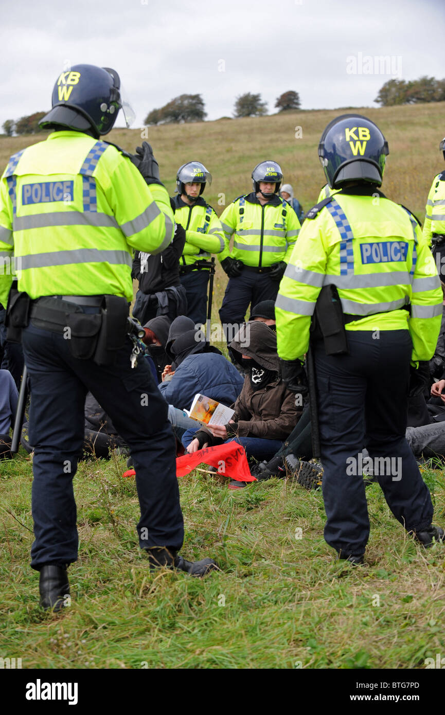 Police officers in riot gear kettle in protesters during a recent Smash EDO march held in Brighton Stock Photo