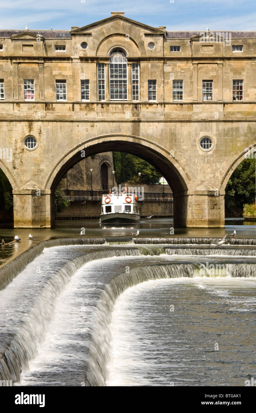 Horizontal wide angle of the grade 1 listed Pulteney Bridge crossing the river Avon in the centre of Bath on a sunny day. Stock Photo