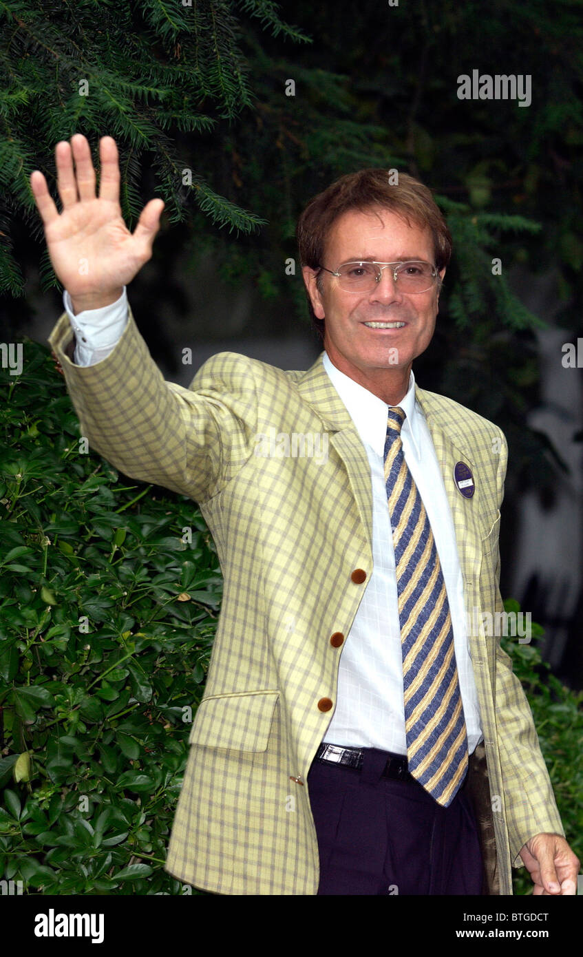 Musician and singer Sir Cliff Richard wearing a yellow checked jacket, at a party in Carlyle Square in Chelsea, London Stock Photo