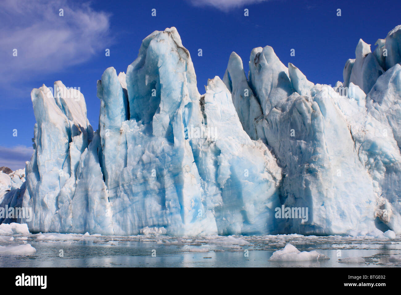Icebergs and Glaciers are ever present in East Greenland Stock Photo