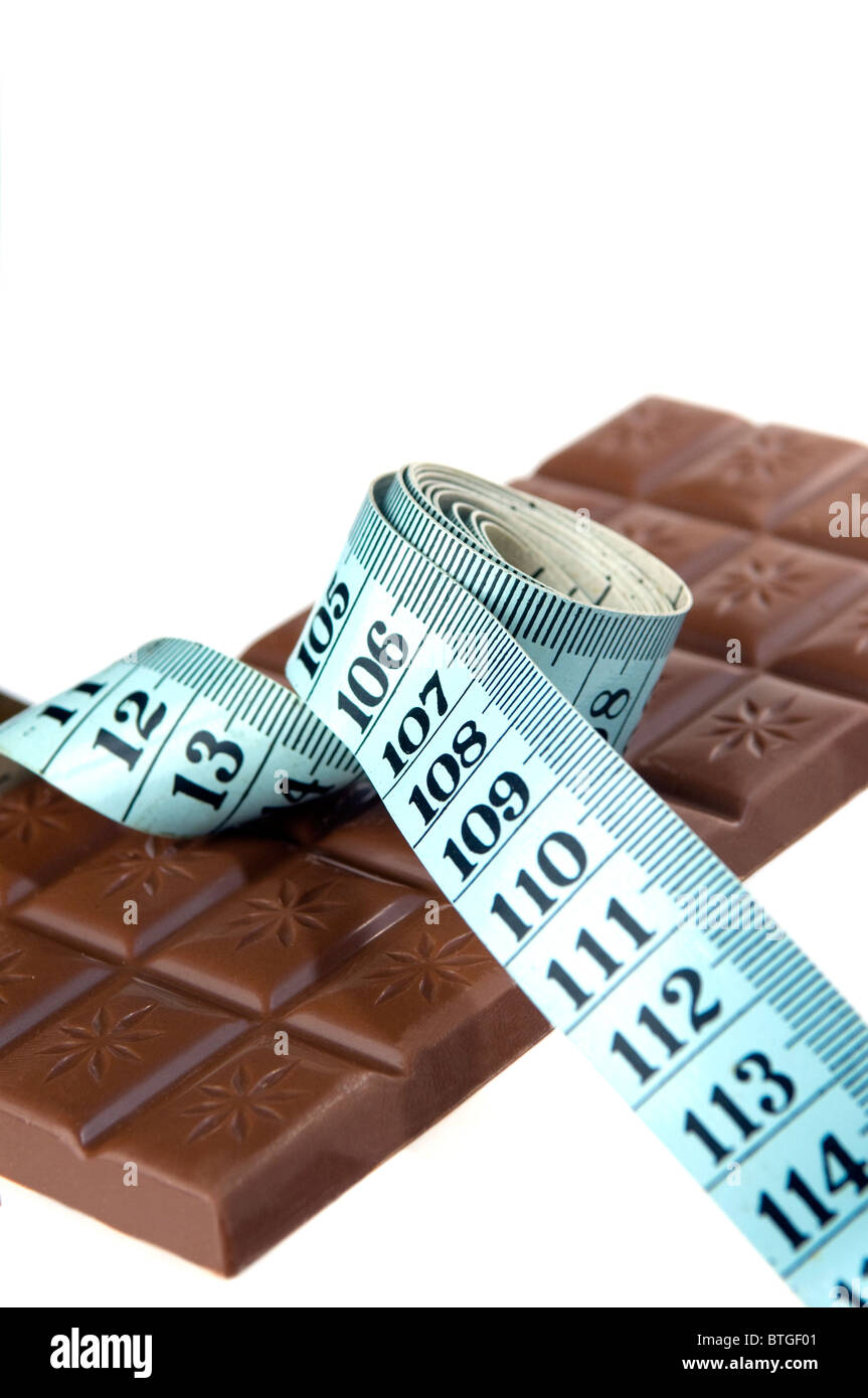 Chocolate bar with measuring tape around Stock Photo - Alamy