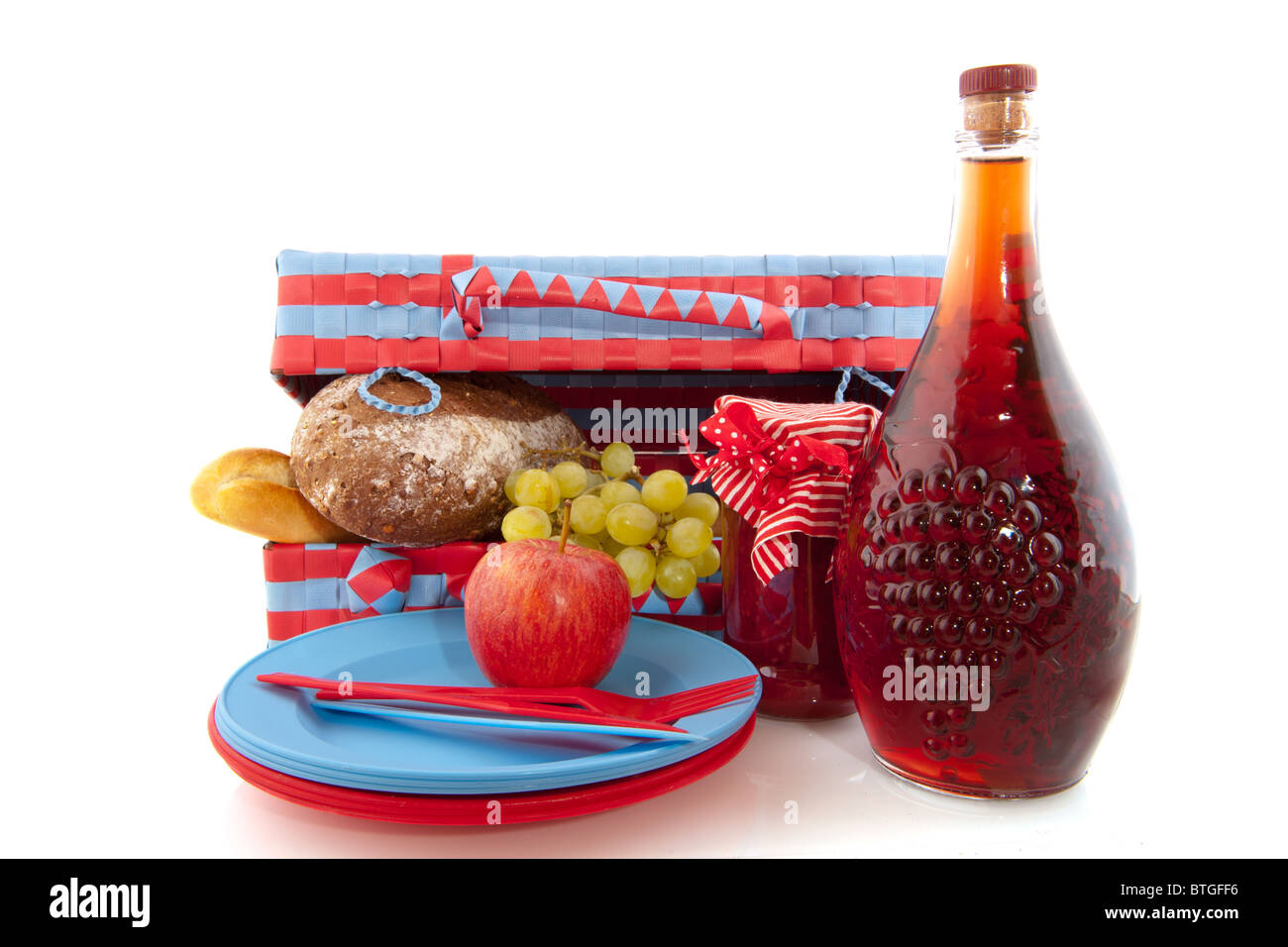 Blue and red picnic basket with bread fruit and wine Stock Photo - Alamy