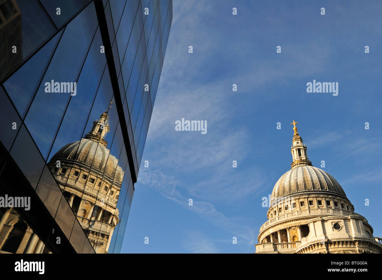 St Paul's cathedral reflected in One New Change shopping destination, London United Kingdom Stock Photo