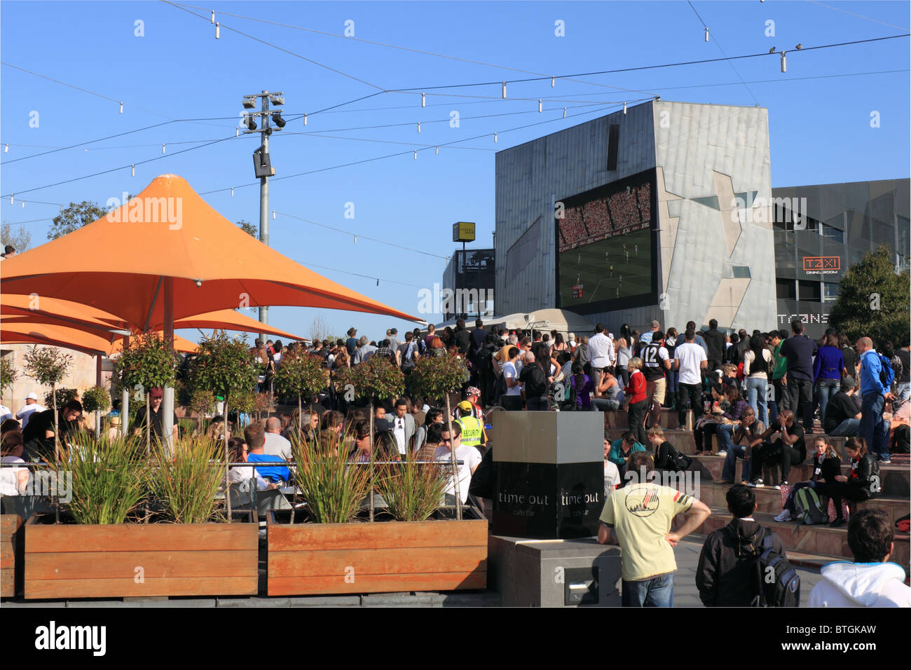 Fans watch Aussie rules football final replay on a big screen in Federation Square, Melbourne, Victoria, Australia, Australasia Stock Photo