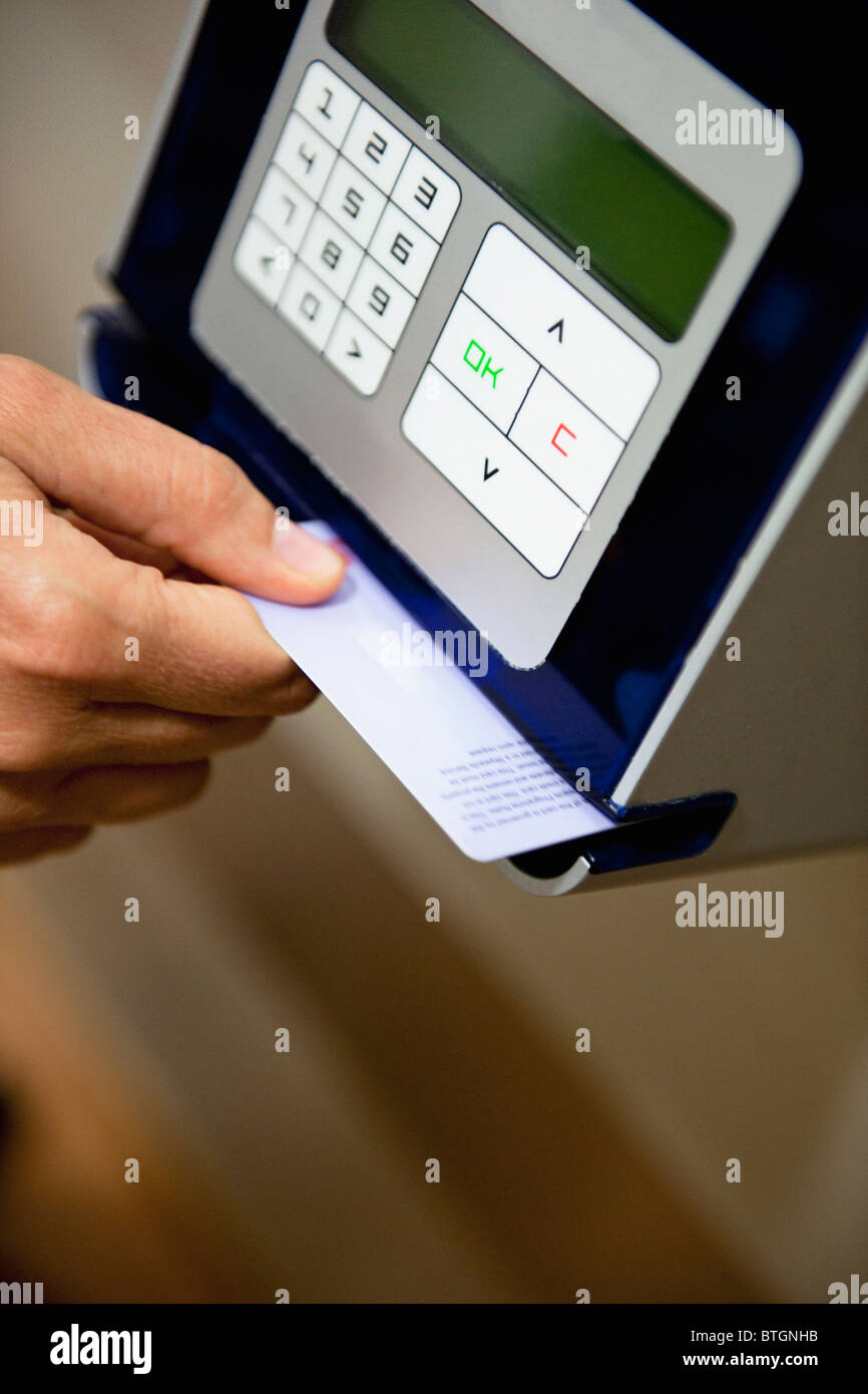 Automated scanner reading Border Crossing Card at the Tijuana