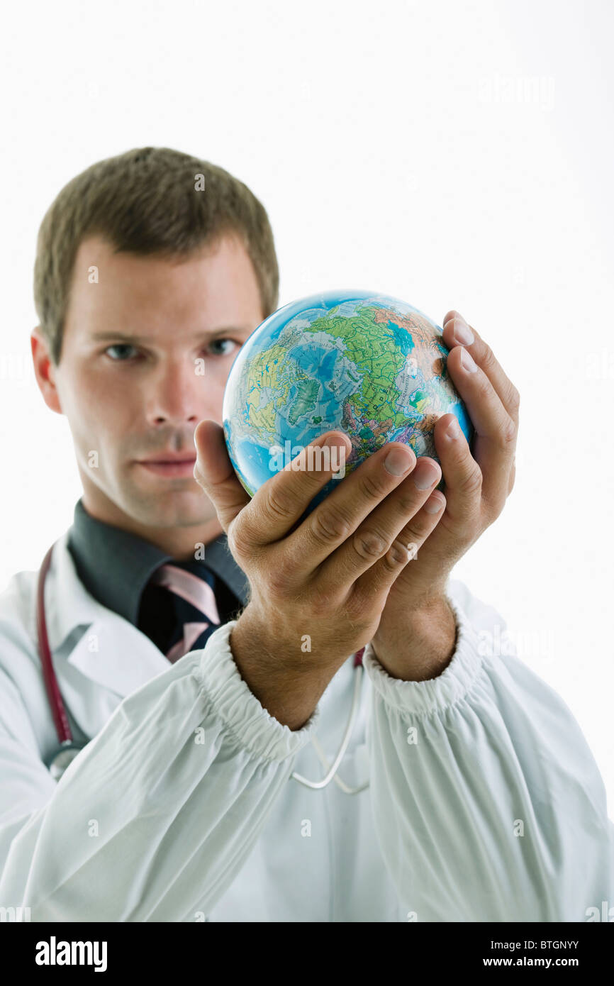 Doctor holding globe Stock Photo Alamy