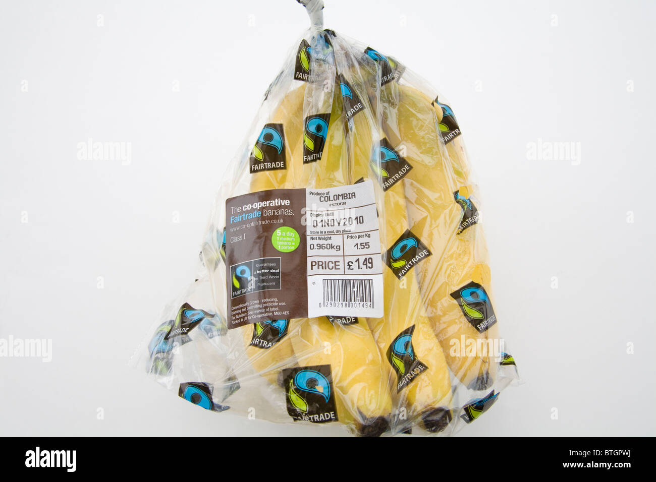 Close up bunch Columbian Fairtrade bananas in plastic packaging with