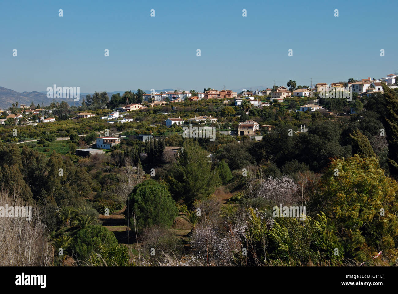 Country houses dotted on the hillsides, Near Alhaurin el Grande, Costa del Sol, Malaga Province, Andalucia, Spain, Europe. Stock Photo