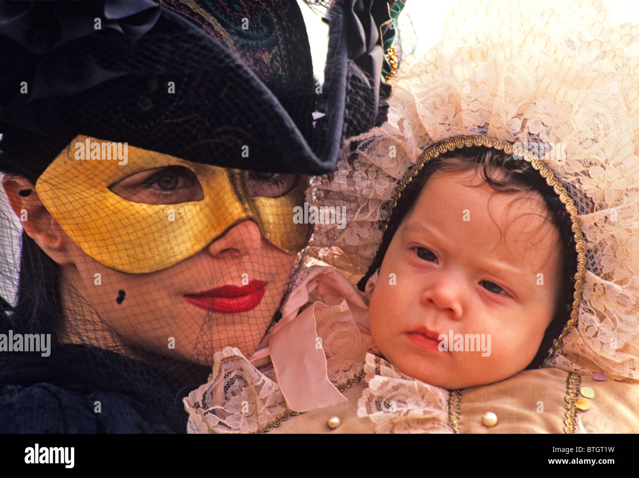 The Venice Carnival with Venetians and children dressed and celebrating ...