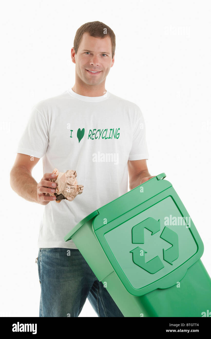 Man throwing paper in the recycling bin Stock Photo Alamy