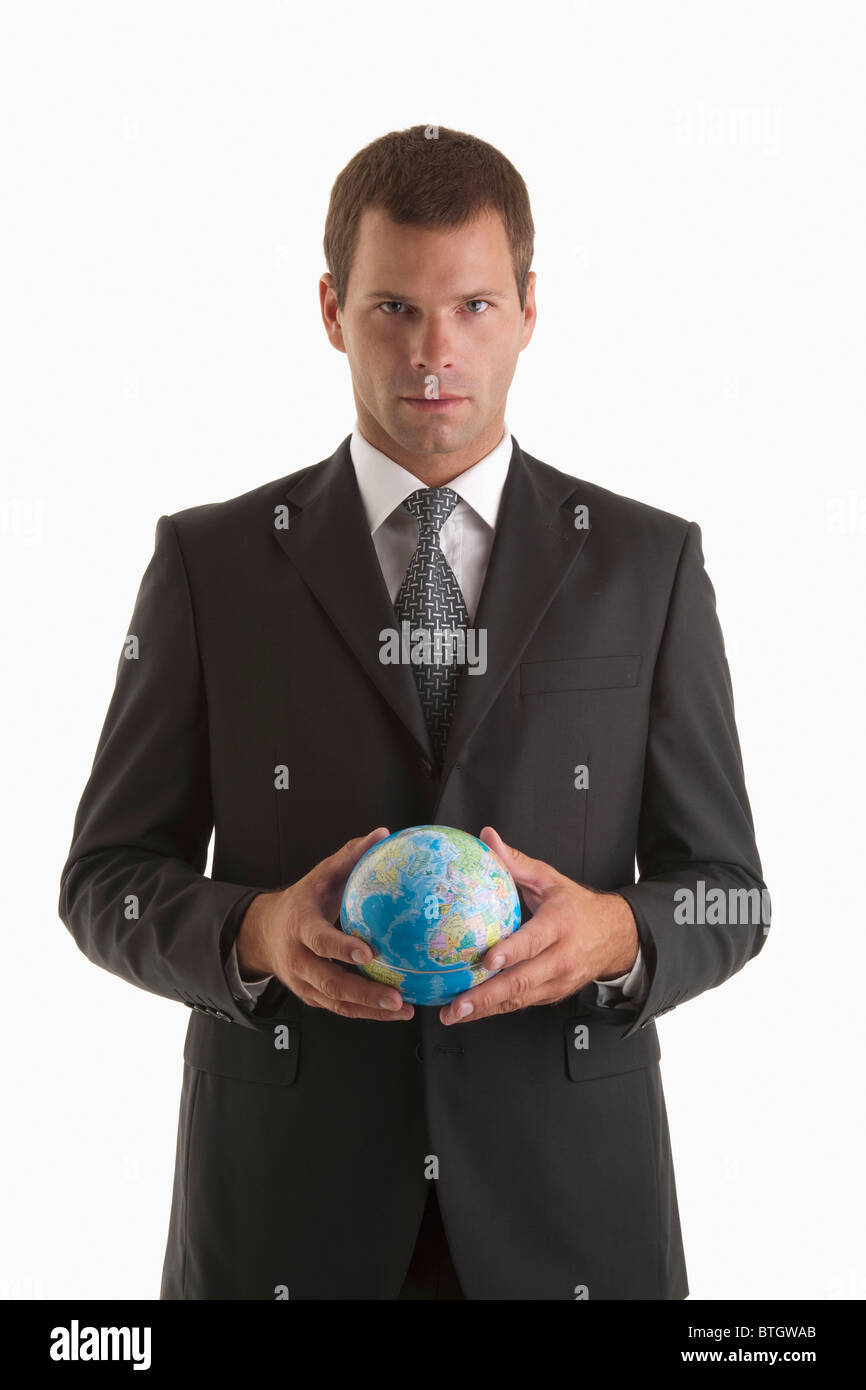 Man holding globe Stock Photo - Alamy