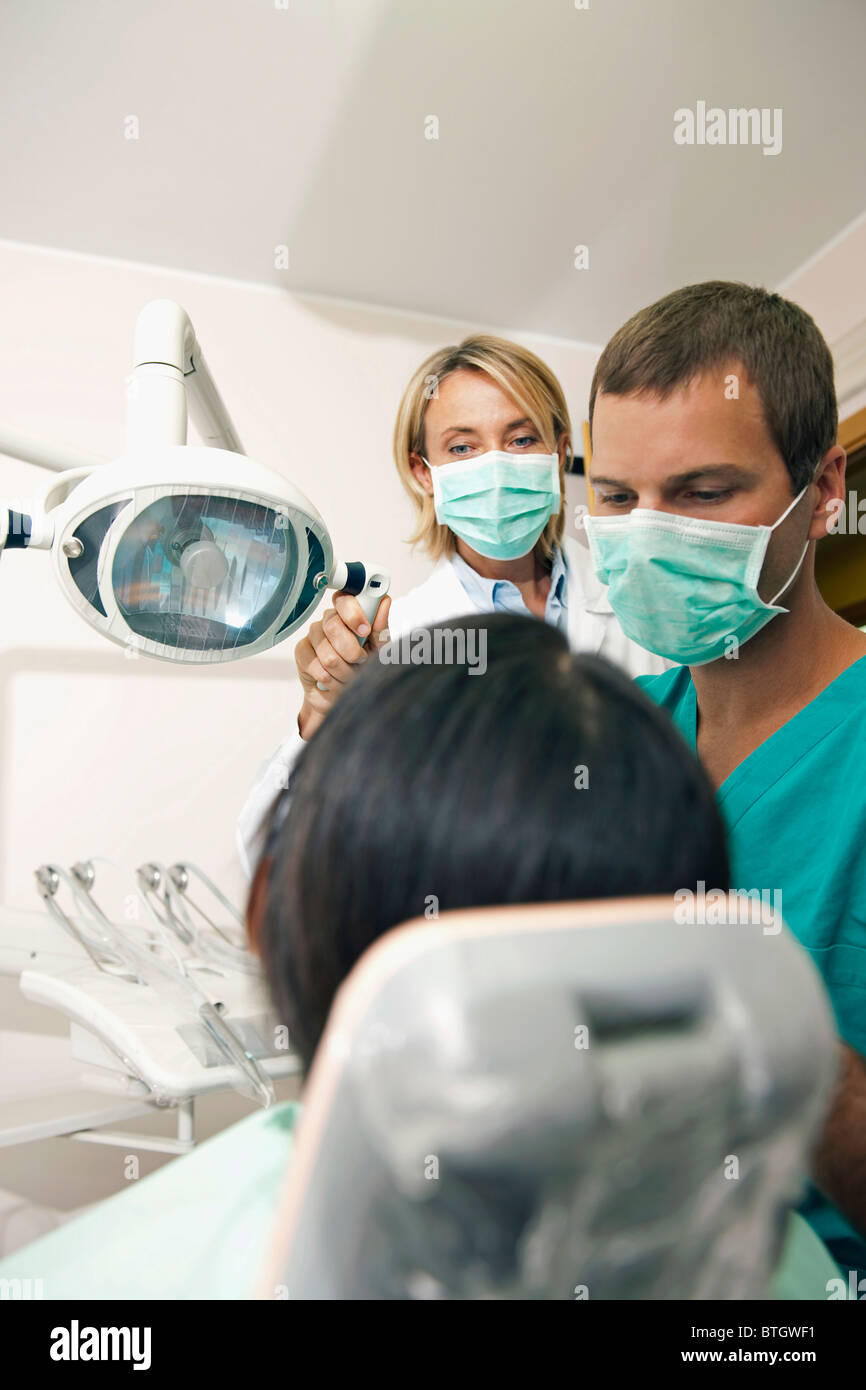 Dental professionals with patient Stock Photo Alamy