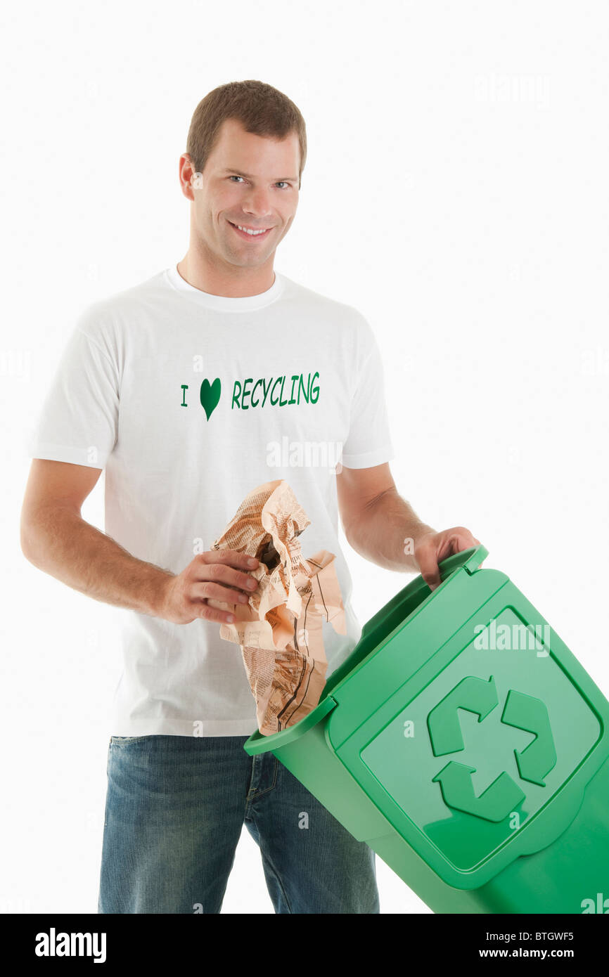 Man throwing paper in the recycling bin Stock Photo - Alamy