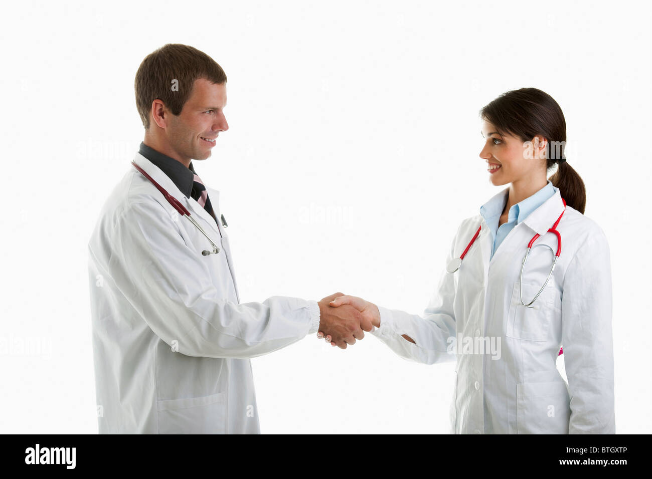 Two doctors shaking hands Stock Photo