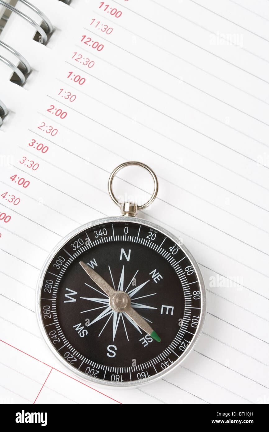 Calendar agenda and compass, concept of time Planning Stock Photo