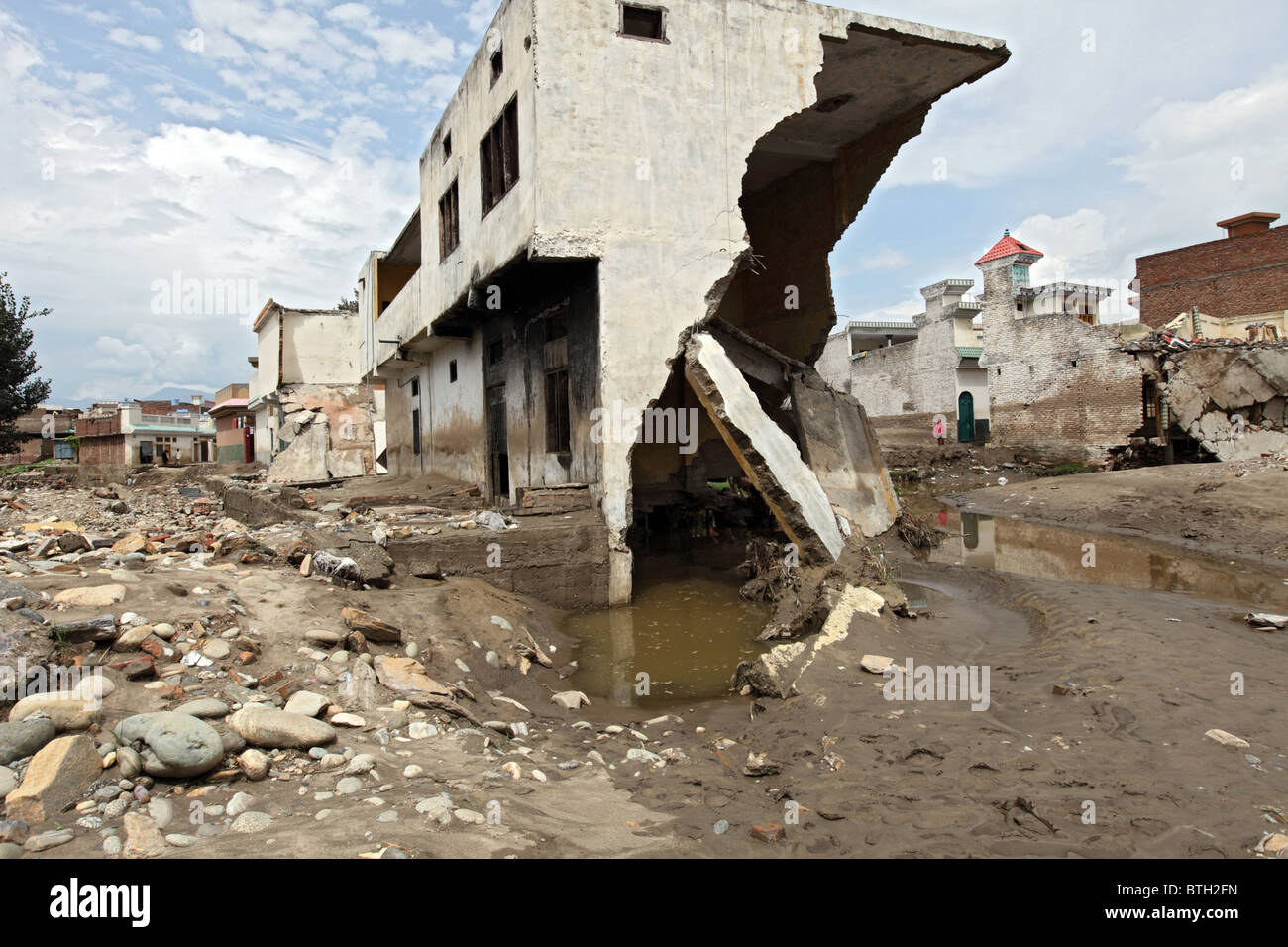 A destroyed house on the banks of River Swat, Mingora, Pakistan Stock Photo