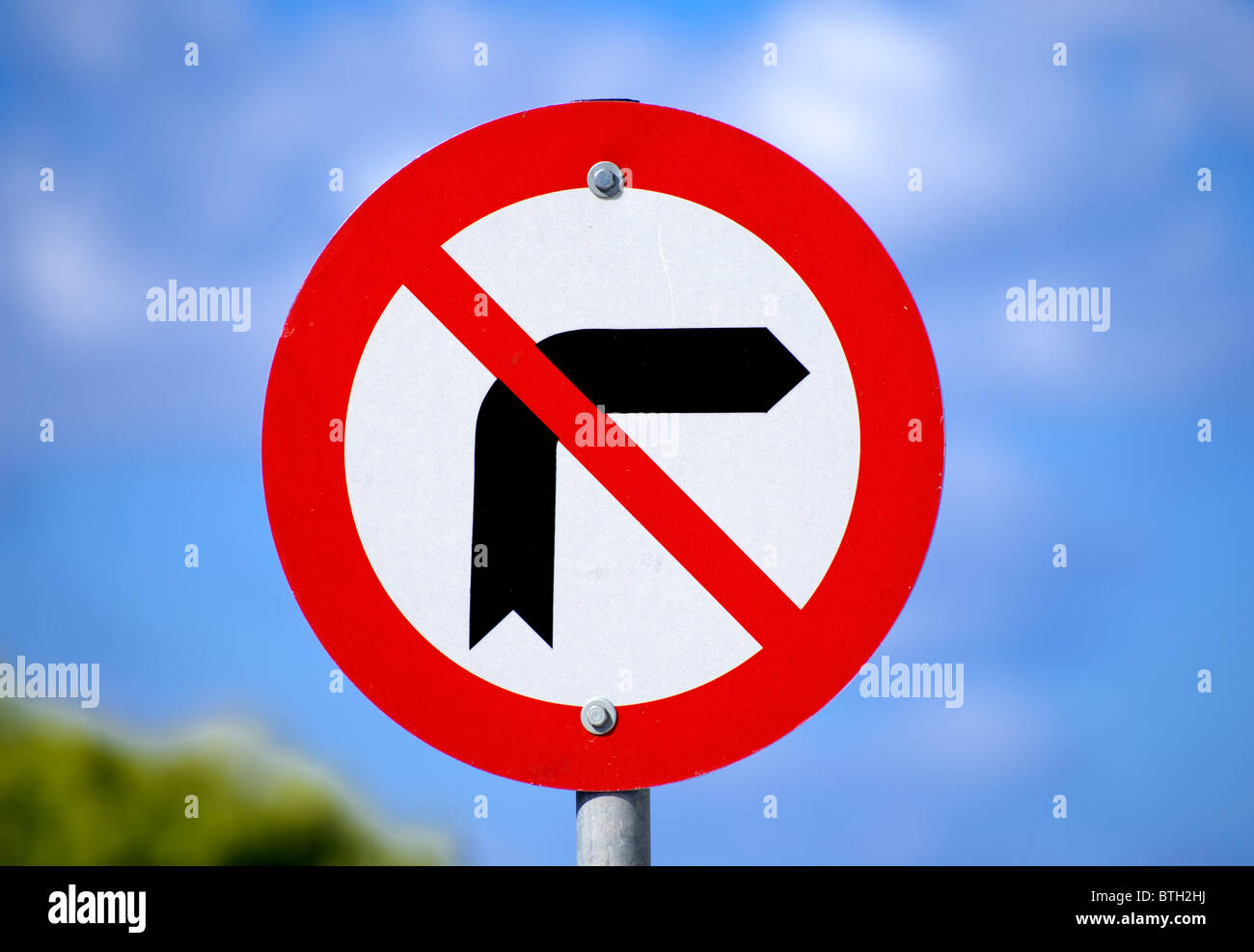 A Greek no right turn traffic sign with an out of focus blue sky for background. Stock Photo