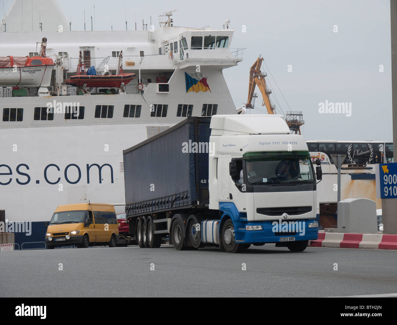 Lorries and vans leave a channel ferry en route for their continental destination Stock Photo