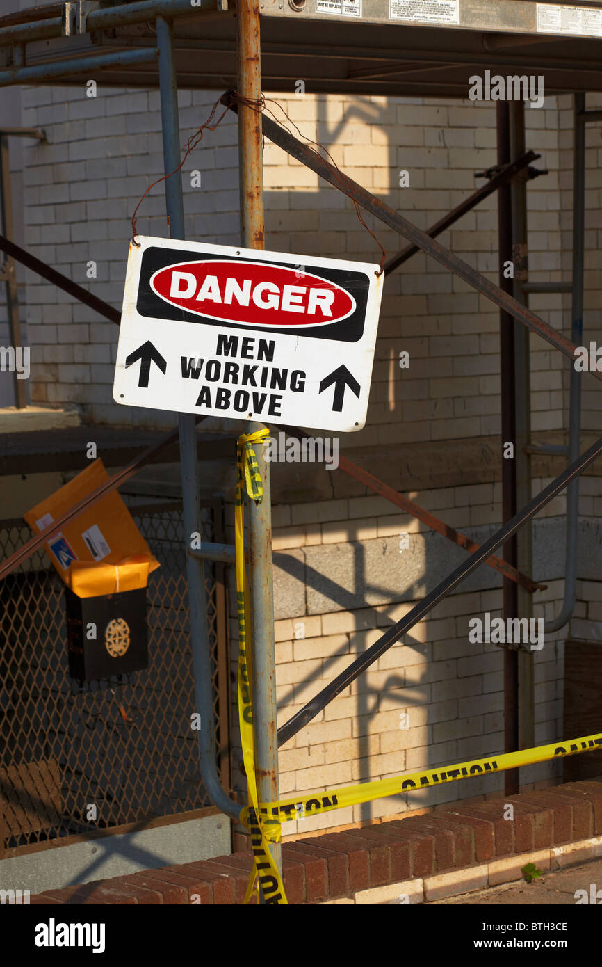 A danger sign indicating men working above, Washington, DC. Stock Photo