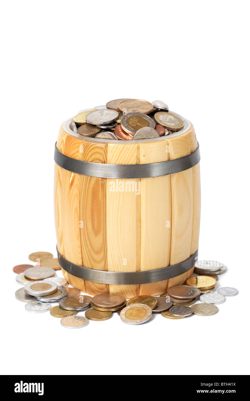 overflowing barrel with various coins Stock Photo