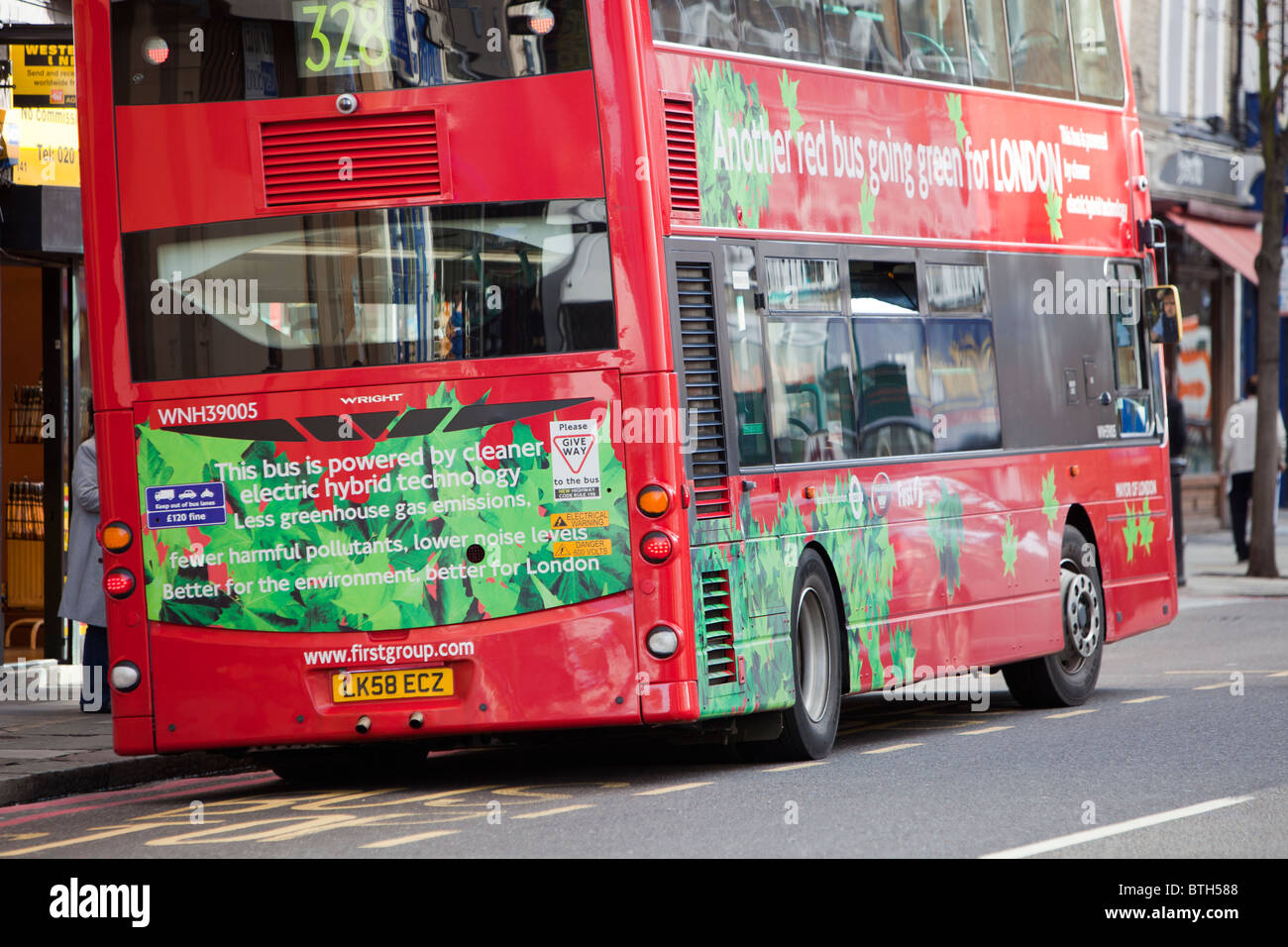 An electric hybrid technology bus in London. Part of Transports for London's commitment to reducing their carbon footprint. Stock Photo