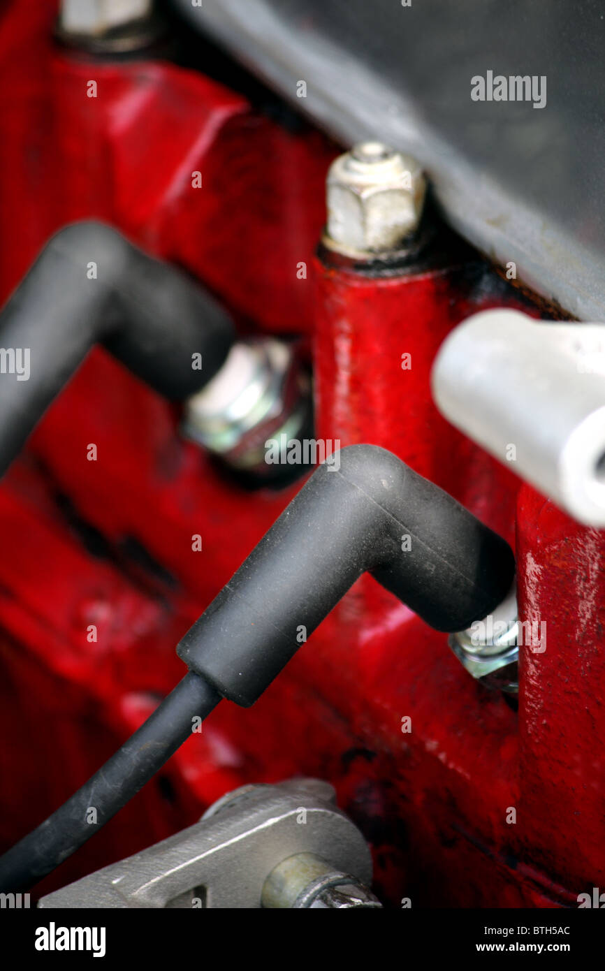 The spark plugs and HT leads in a car engine after replacing the old ones with new plugs Stock
