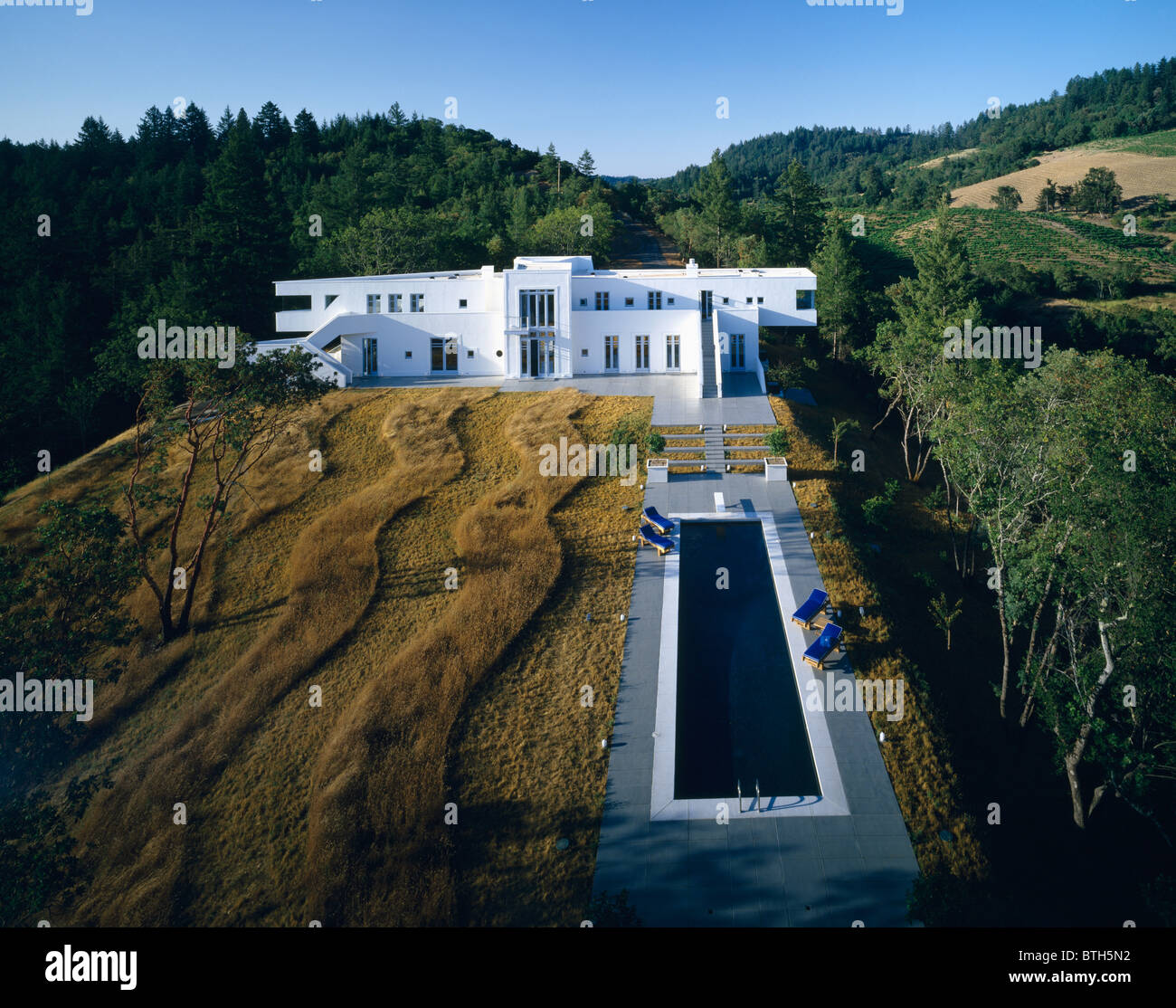 Large white architectural house and swimming pool in Napa Valley with