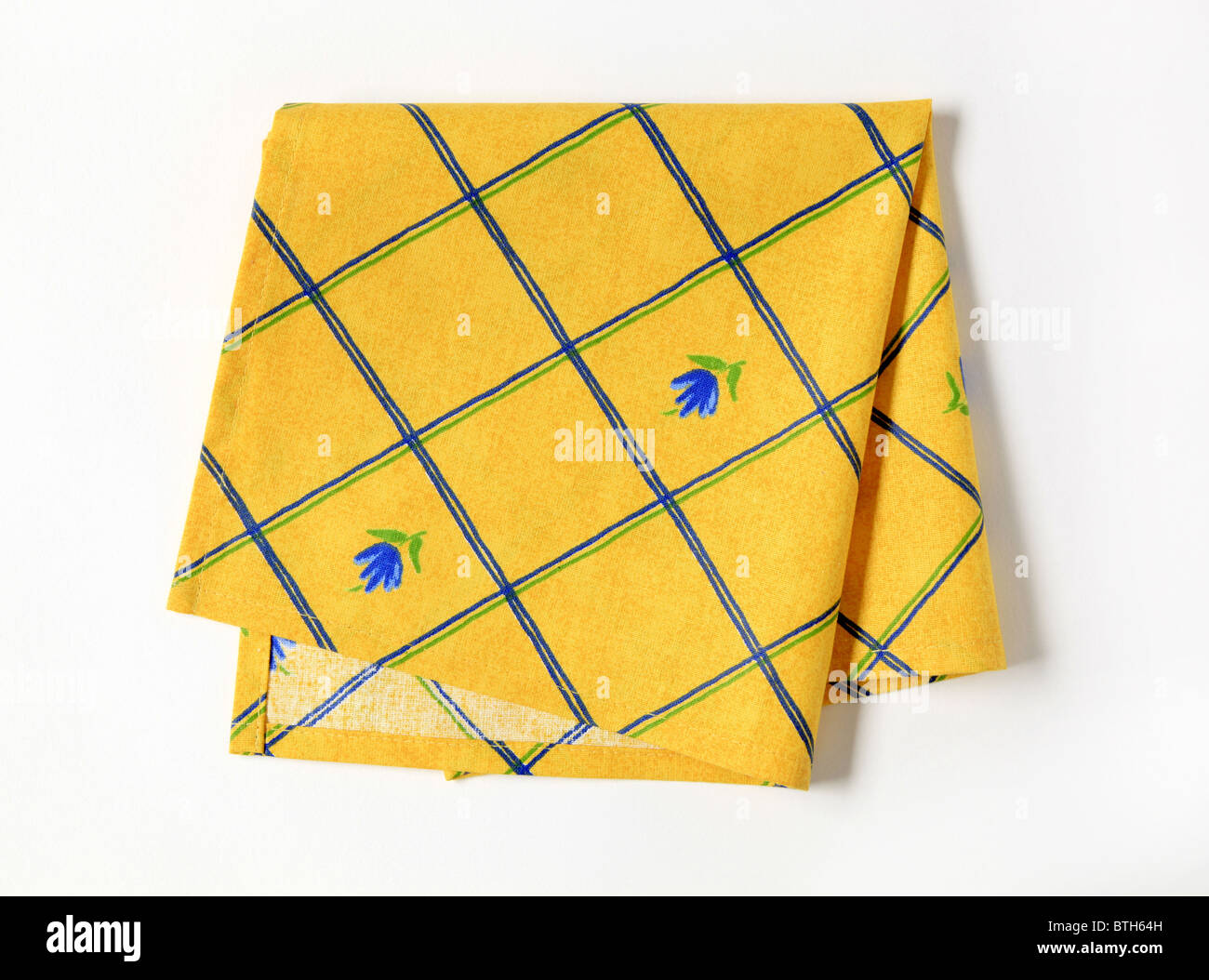 Small yellow napkin with flower pattern Stock Photo