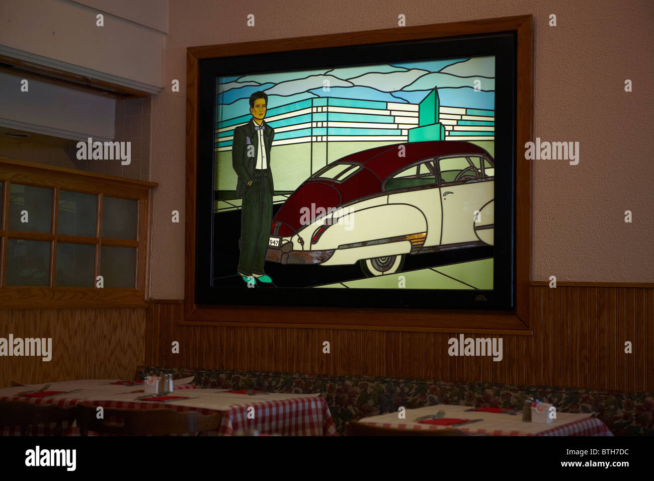 A contemporary stained glass art installation in an Italian restaurant. Stock Photo