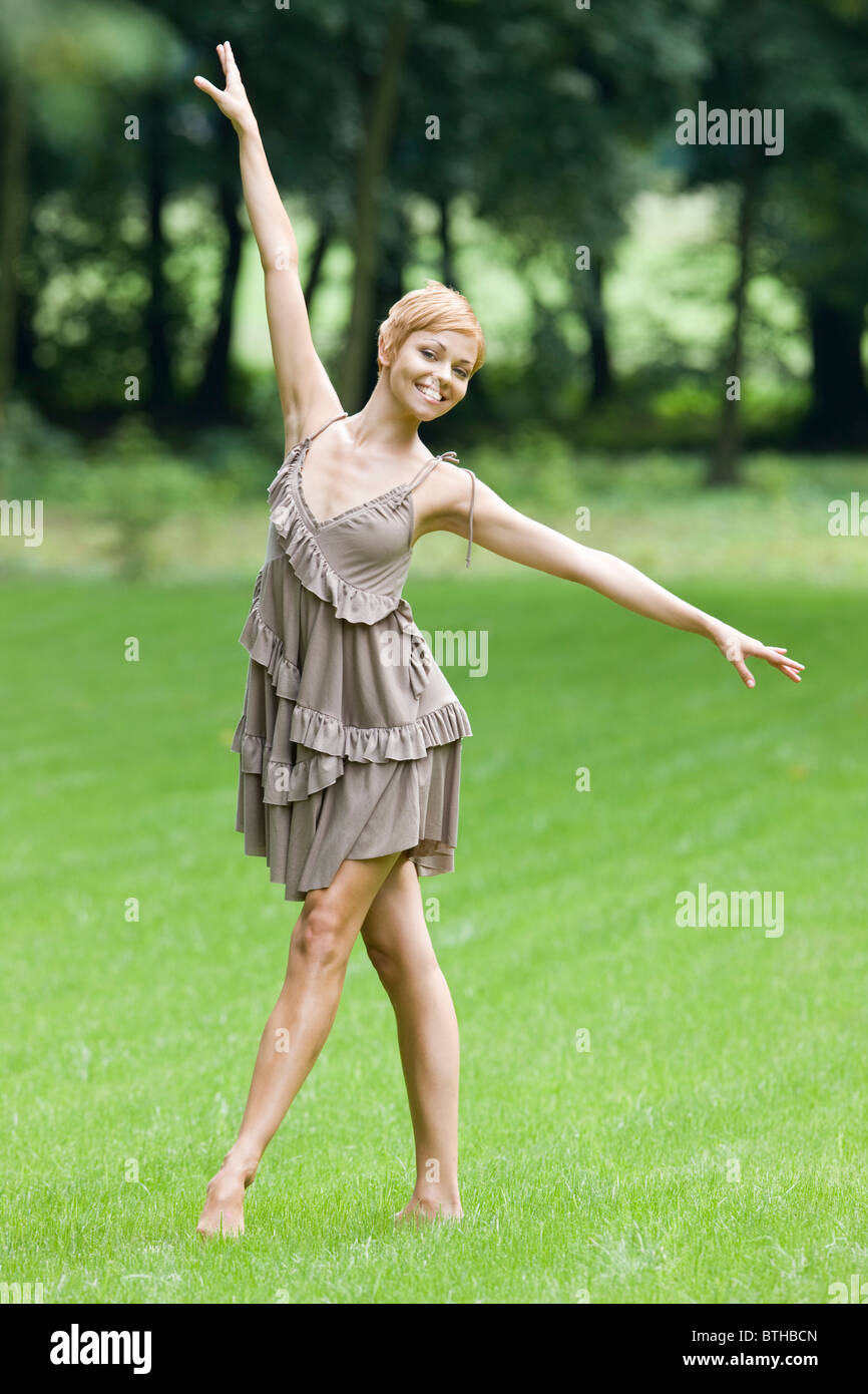 young woman dancing in park Stock Photo - Alamy