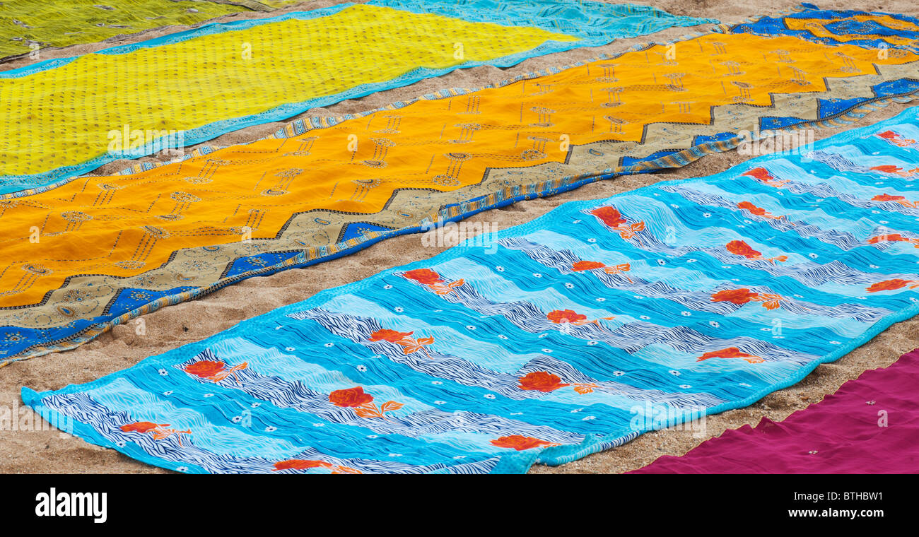 Colourful indian sari drying on the sand Stock Photo