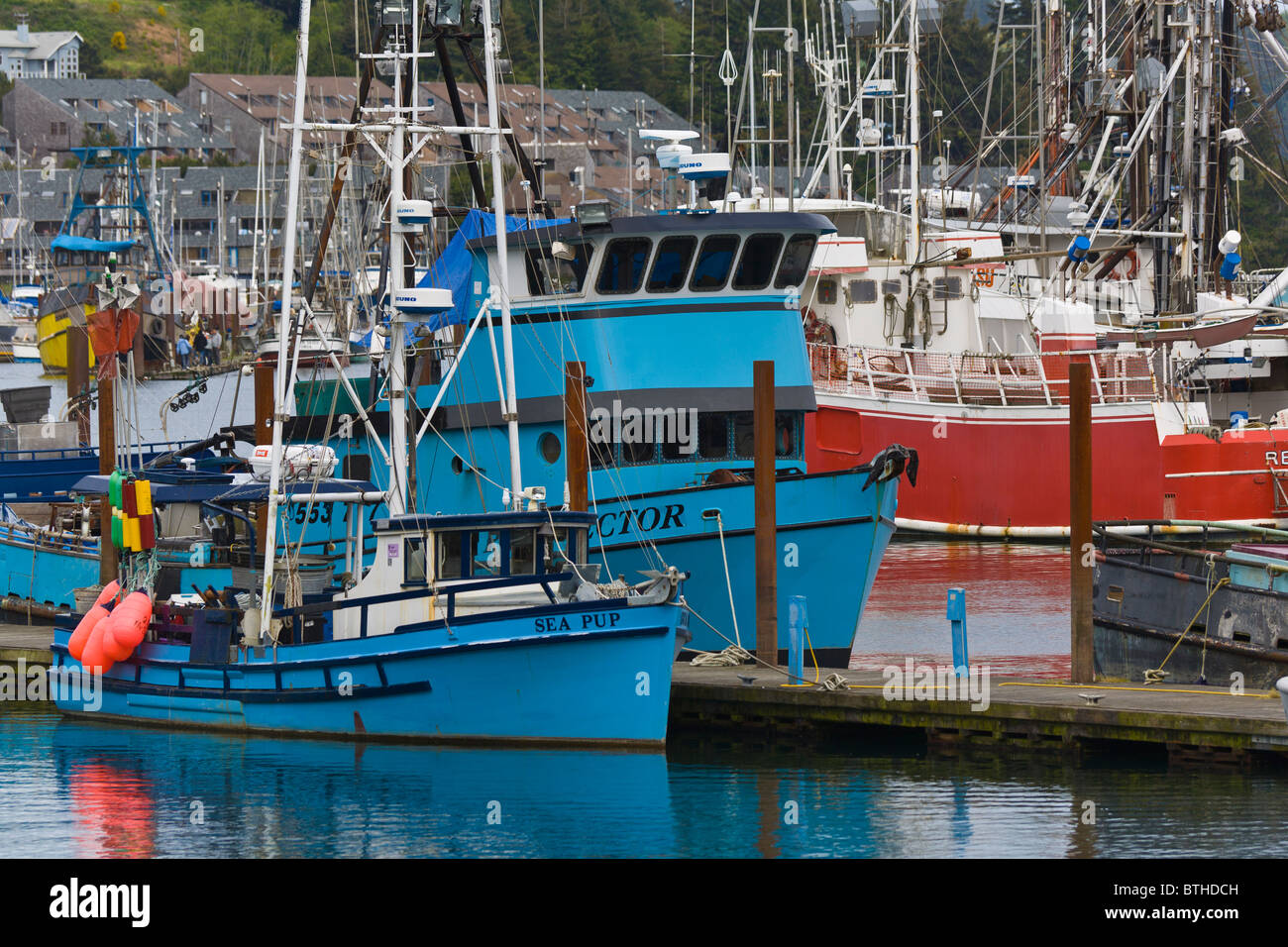 Commercial fishing boats in marina on the Siuslaw River in Florence Oregon Stock Photo