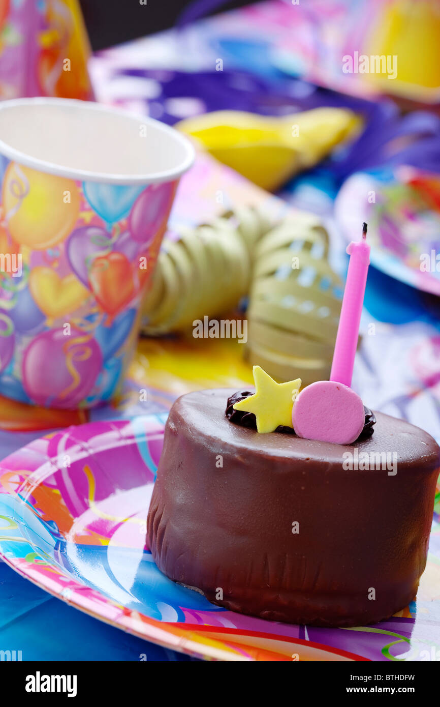 closeup of birthday party table decor and cake Stock Photo