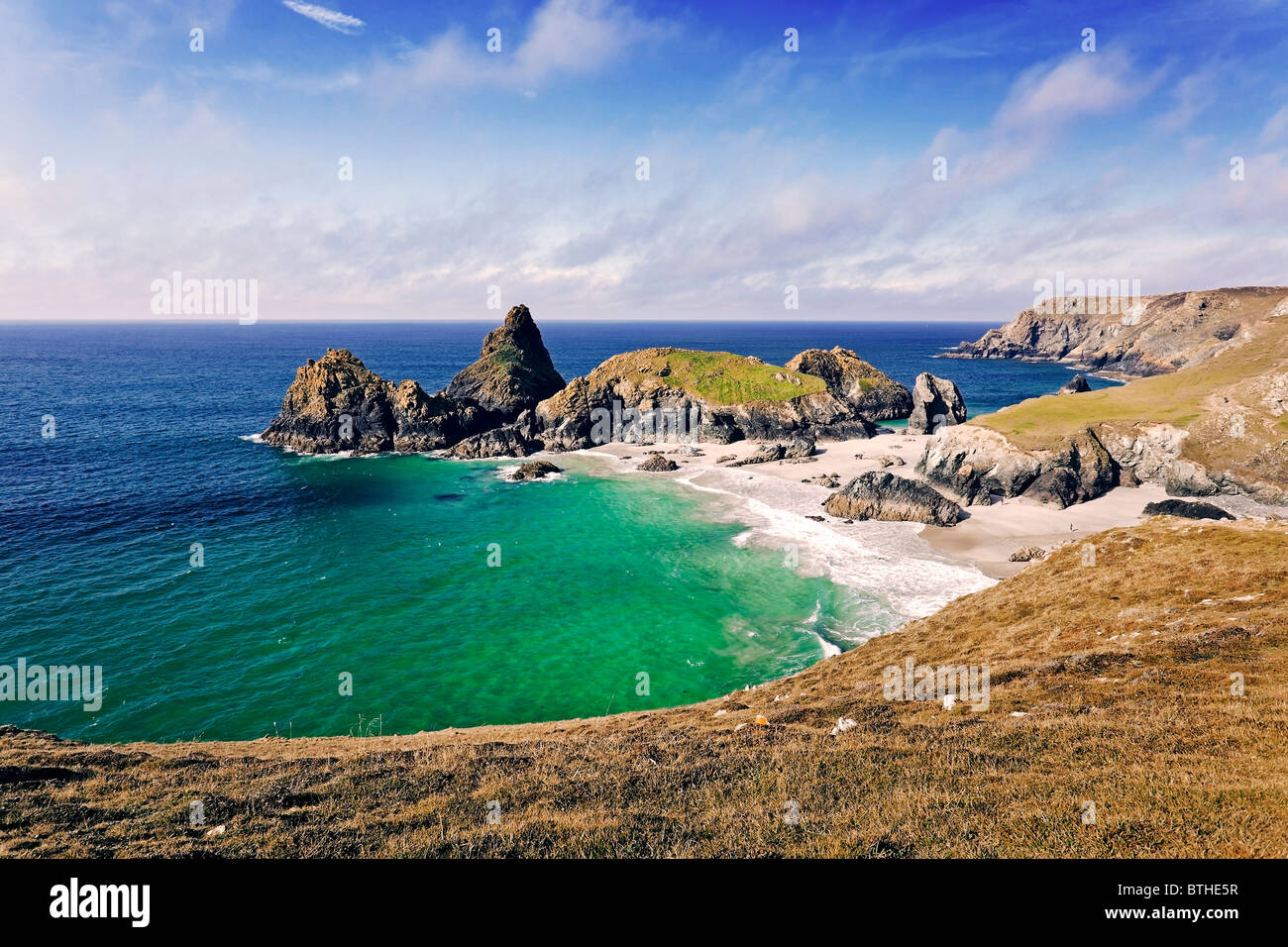 A wide view from the clifftop over Kynance Cove, Cornwall, as seen from the South West Coast Path Stock Photo