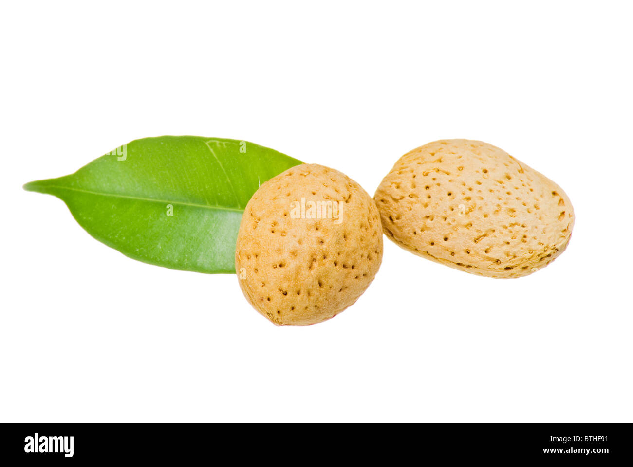 Almonds with green leaf isolated Stock Photo Alamy