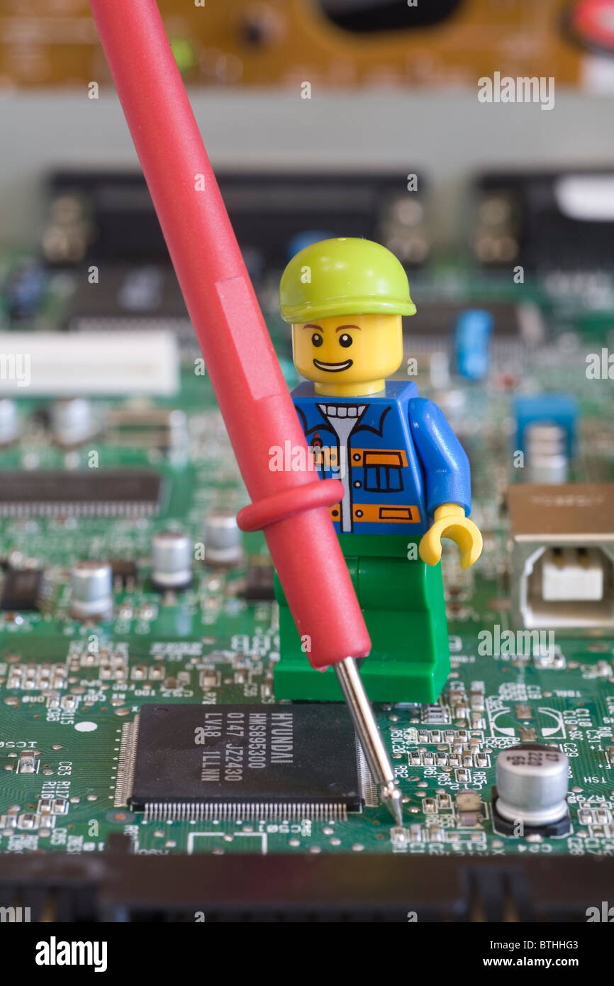 Lego engineer or technician on an electronic circuit board with a testing  probe Stock Photo - Alamy