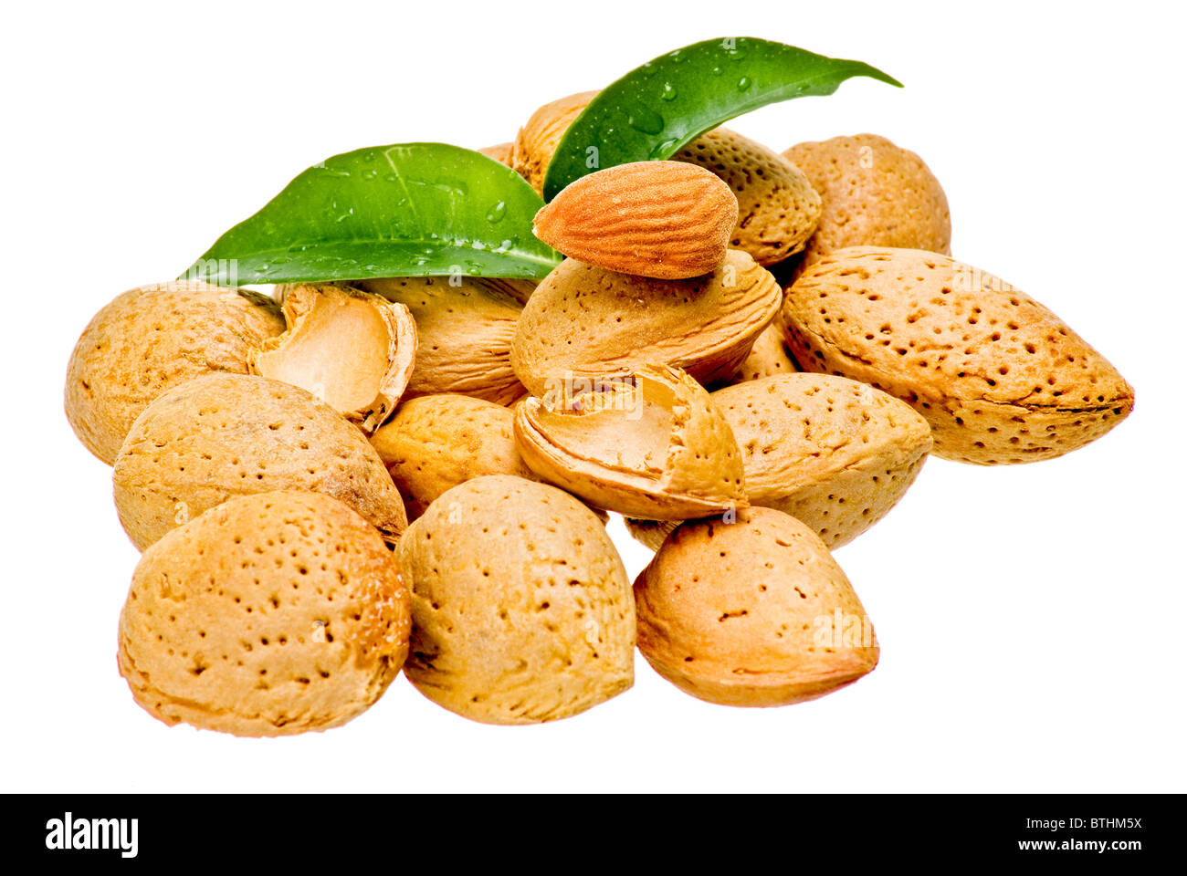 Almonds with green leaves isolated Stock Photo Alamy