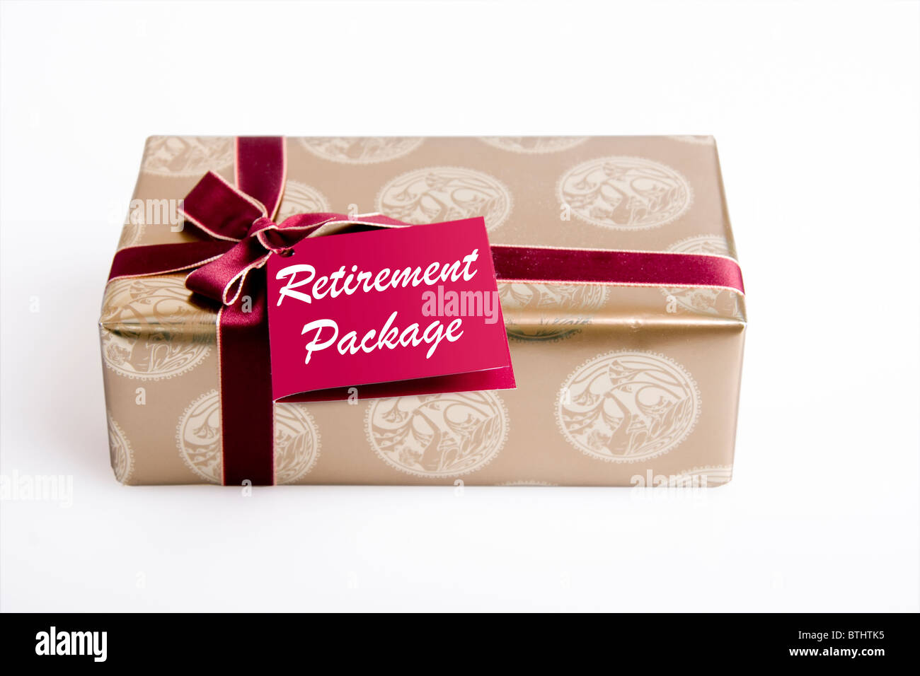 Gift box with ribbon with the words Retirement Package Stock Photo