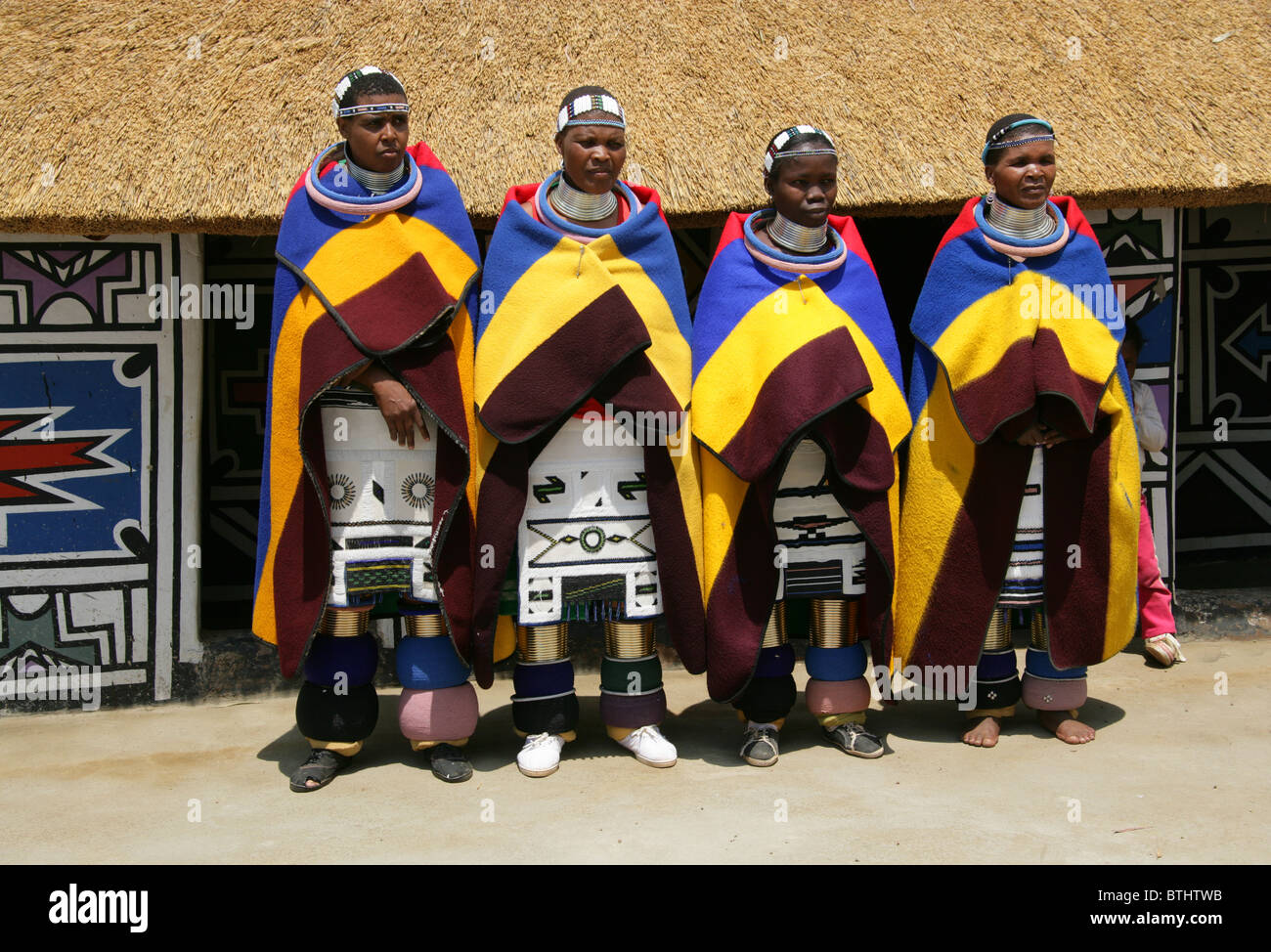 Ndebele Women in Traditional Costume, Ndelebe Cultural Village, Botshabelo, South Africa. Stock Photo
