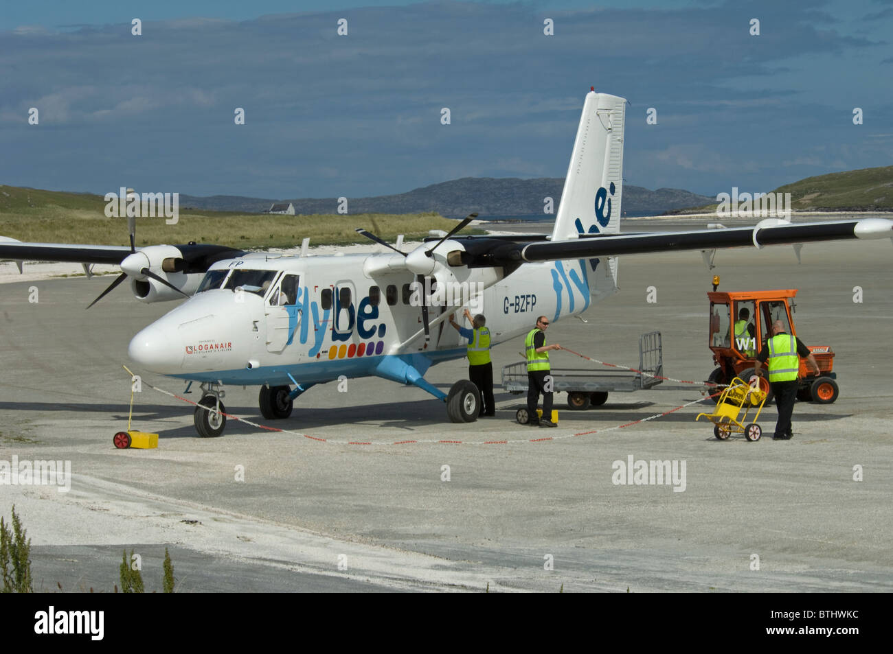 A twin Otter Aircraft Boarding on the cockleshell beach at Barra Airstrip, Outer Hebrides, Scotland. SCO 6676 Stock Photo
