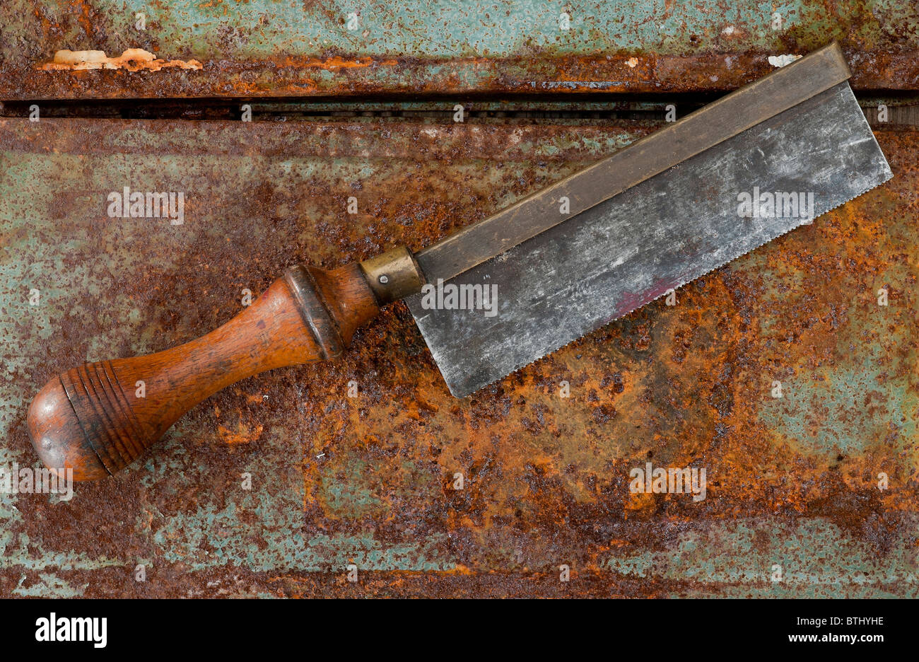 Back Saw on a rusty background Stock Photo - Alamy