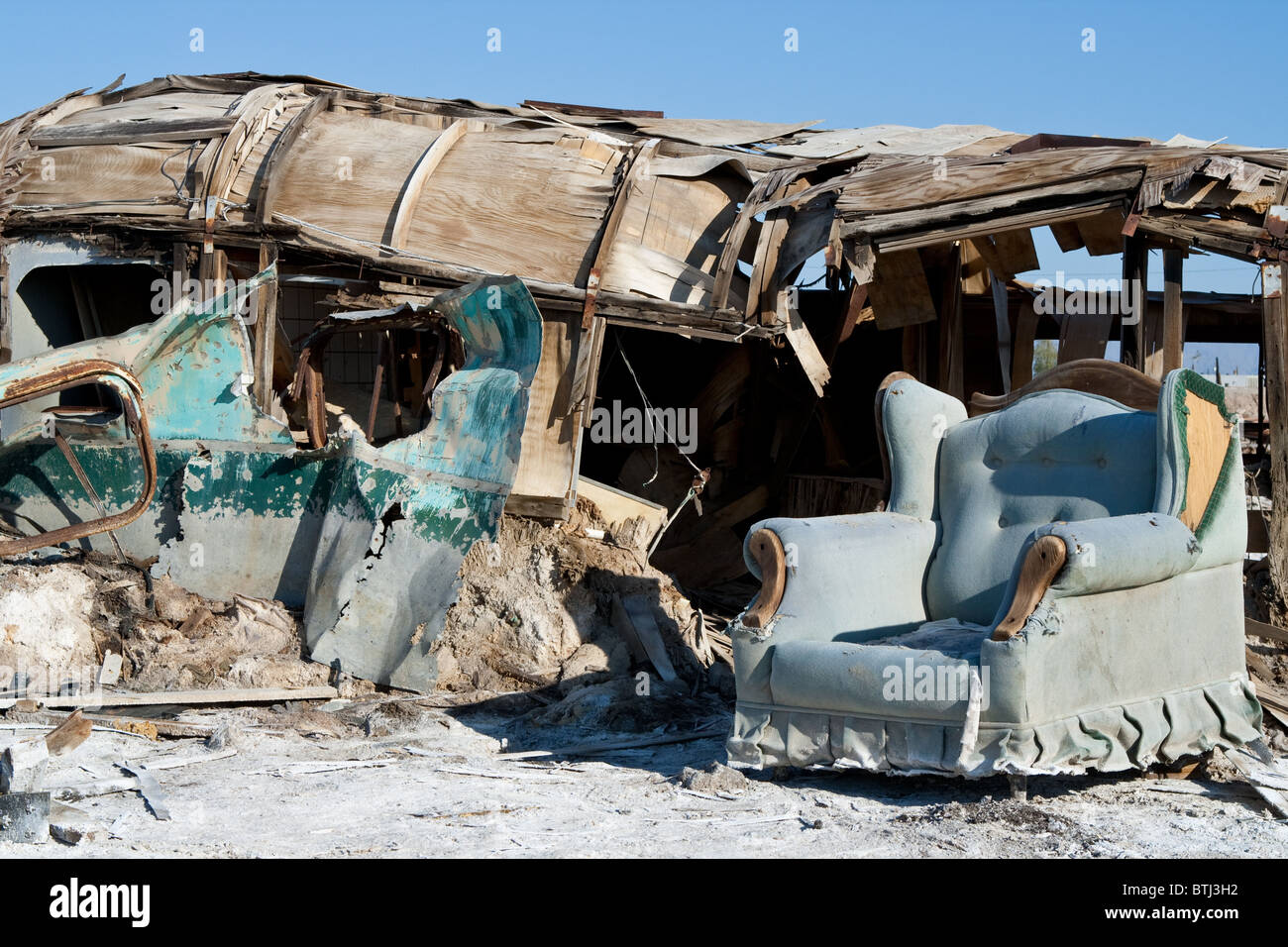 Broken sofa and trailer in Bombay Beach, Salton Sea, California Stock Photo