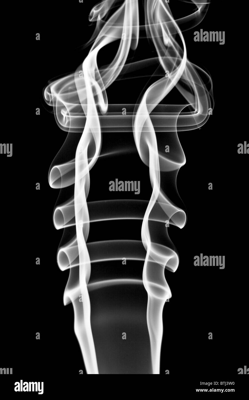 Abstract white smoke. Isolated on black background Stock Photo - Alamy