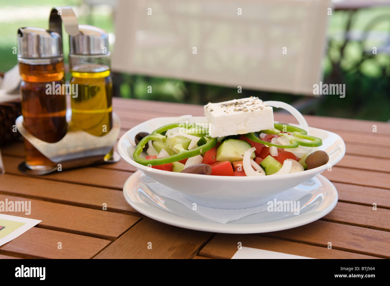 Traditional Greek Salad on Table Stock Photo