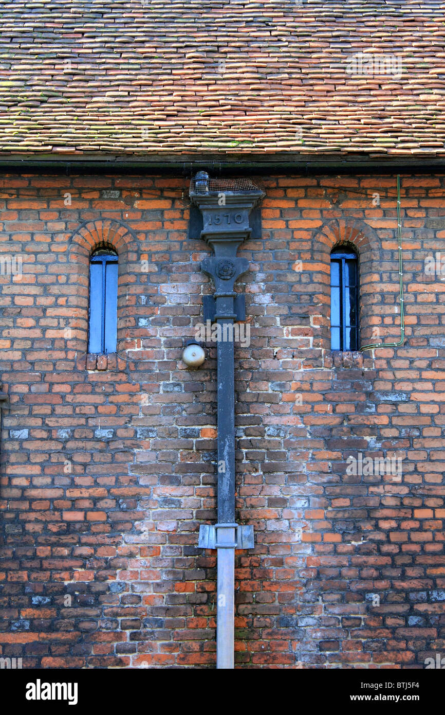 Hampton Court stables date from Elizabethan times, gutter shows date 1570 England UK. Stock Photo