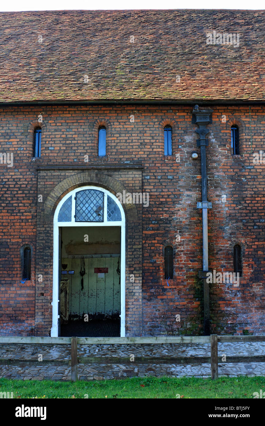 Hampton Court stables date from Elizabethan times, gutter shows date 1570 England UK. Stock Photo