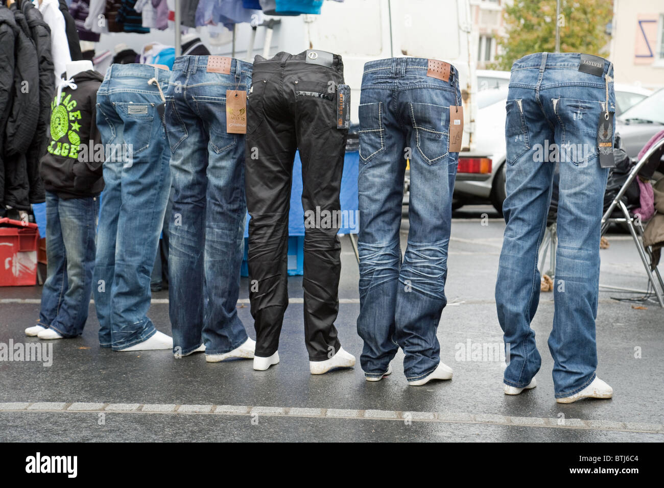 Denim jeans on tailors dummies for sale in the street market at Coulommiers town near Paris  ile de france France Stock Photo