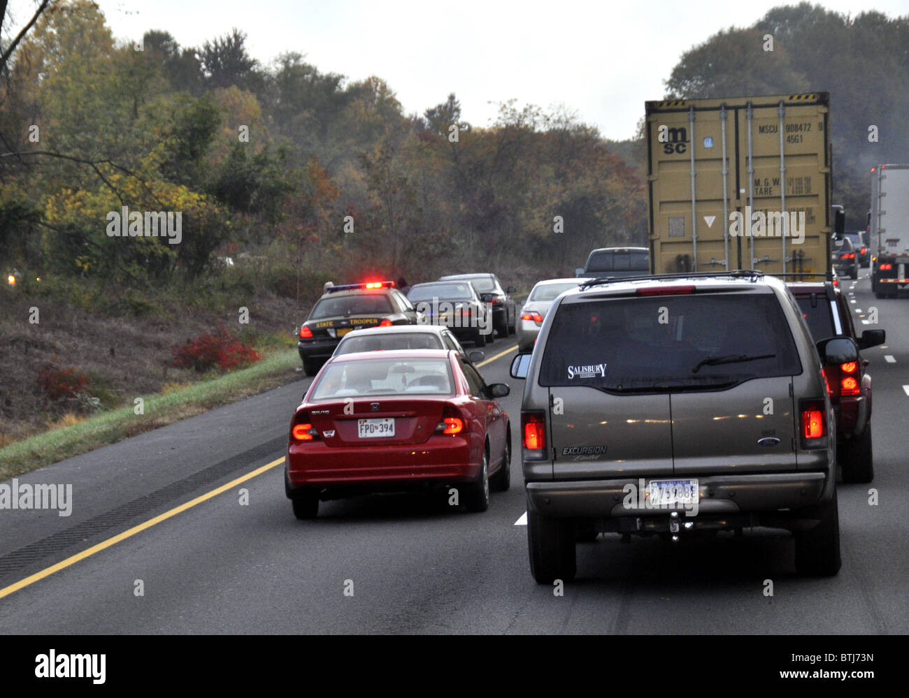 traffic slows after a state trooper pulls a motorist over on I 95 Stock Photo