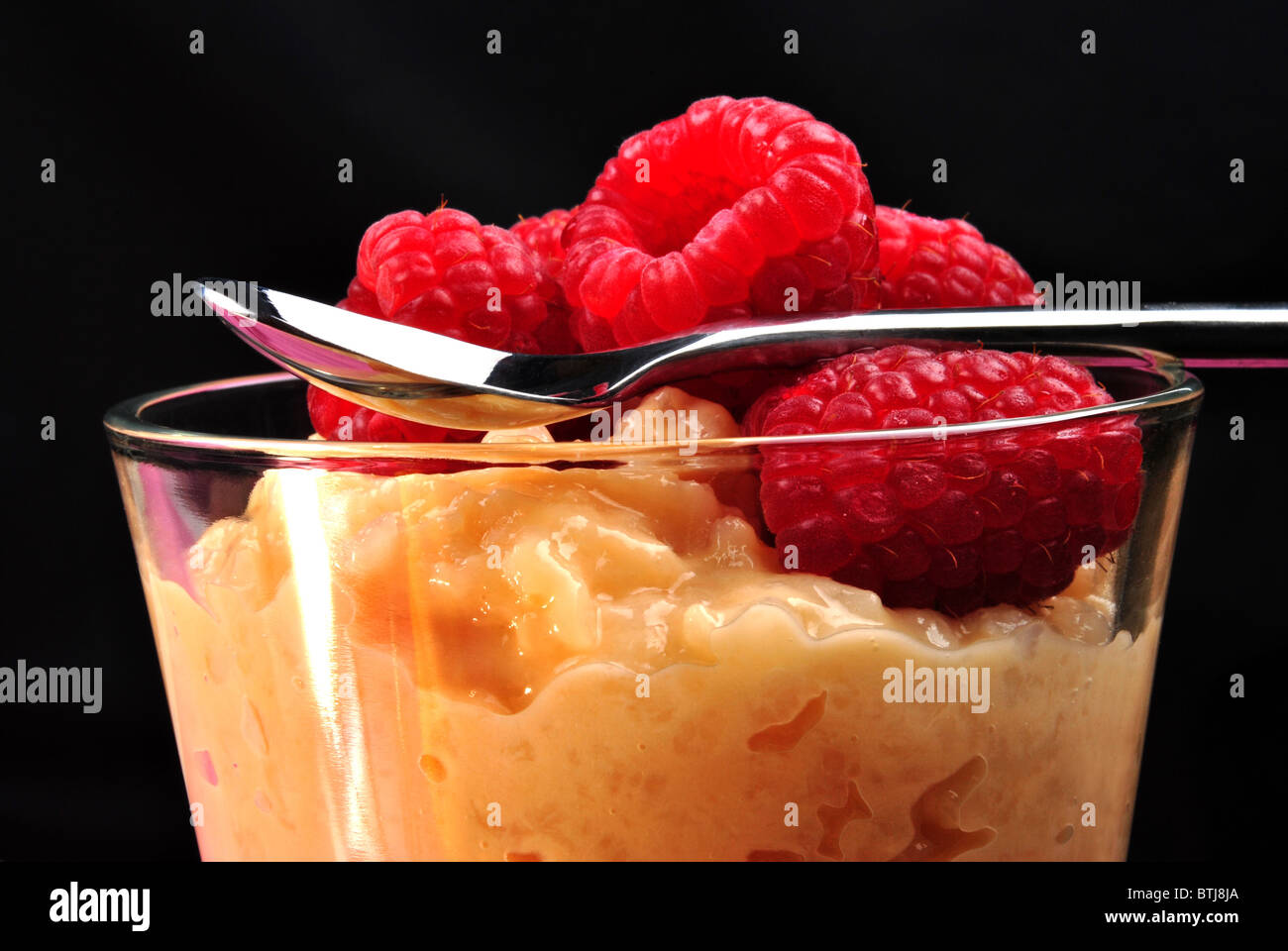 home made creamed rice pudding with raspberries Stock Photo - Alamy