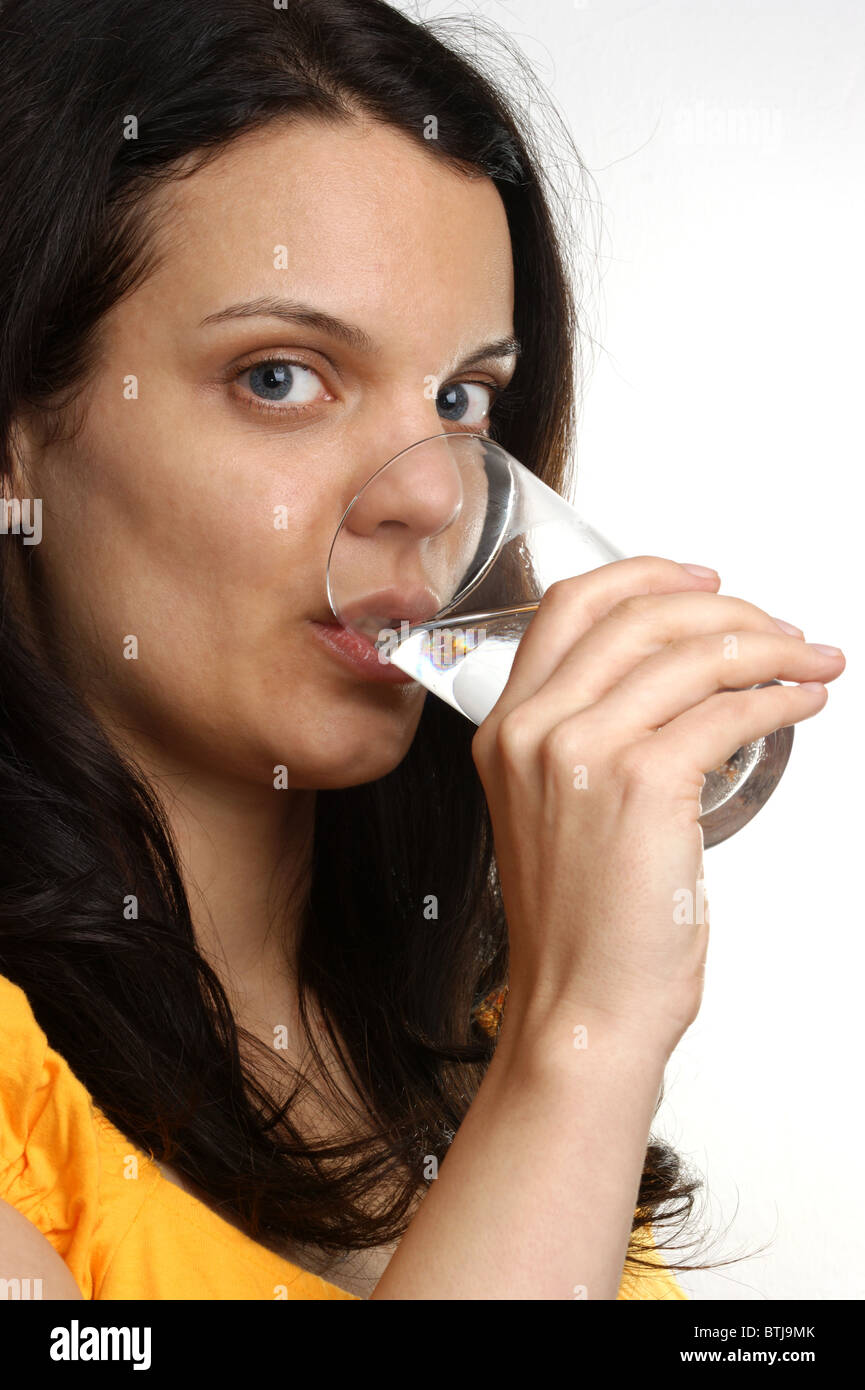 a young woman drinks cold water Stock Photo Alamy